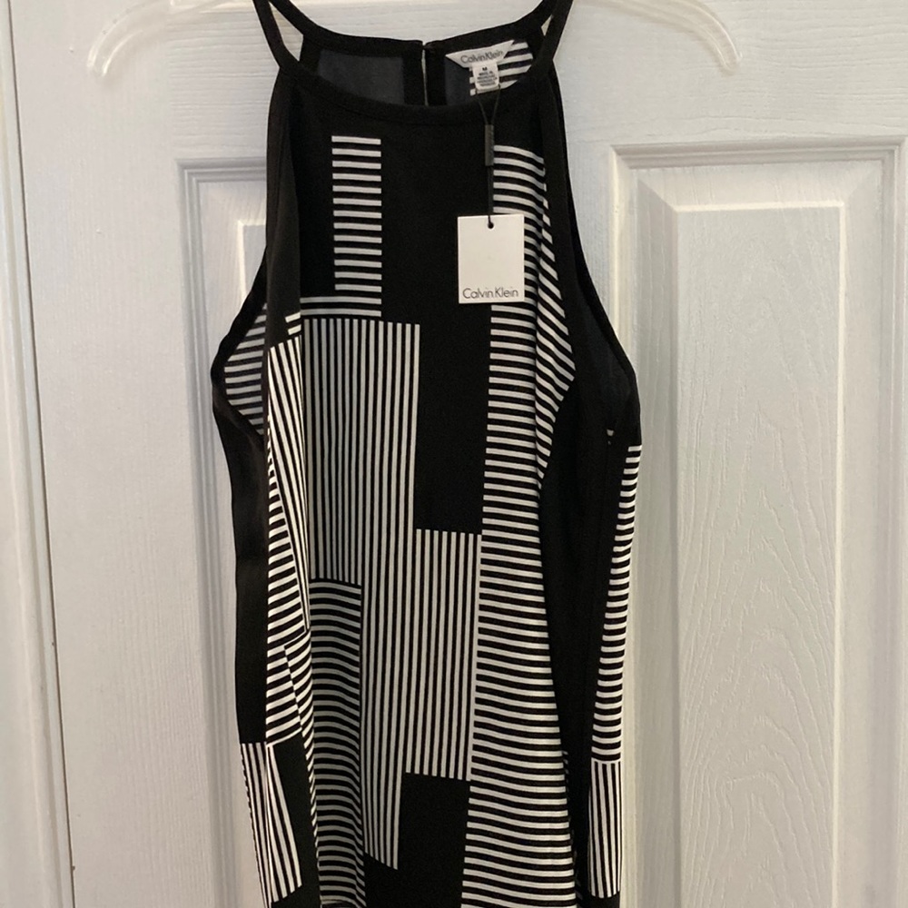 NWT. Calvin Klein sleeveless blouse. Black/white stripes. Size M.